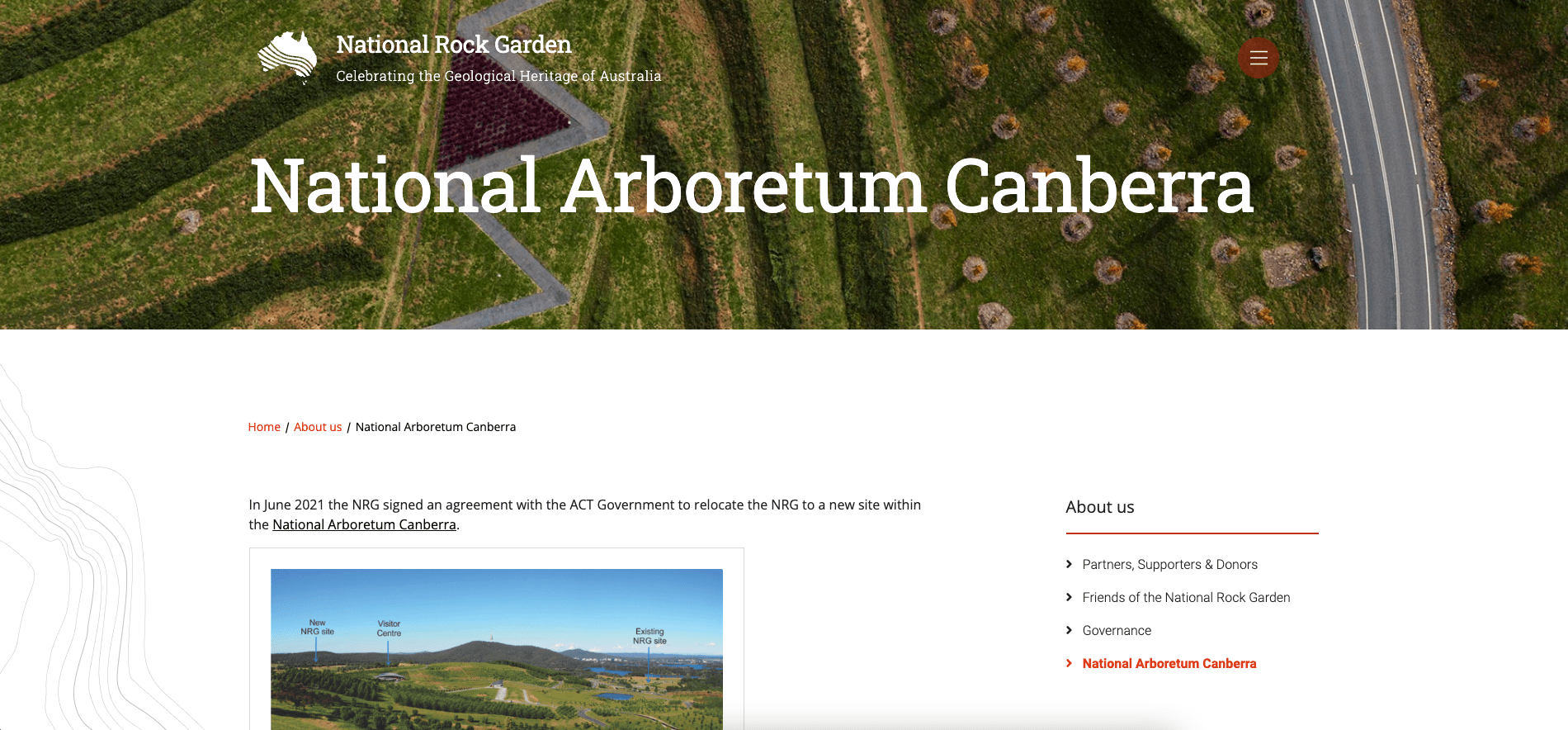 Aerial view of National Arboretum Canberra showing landscaped hills, pathways, and tree plantings.