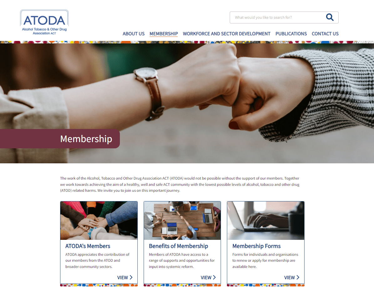 Two people giving a fist bump above a webpage section titled "Membership" on the ATODA website.
