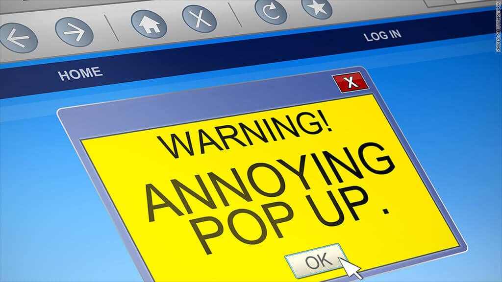 Browser screen showing a bright yellow pop-up window with the message "Warning! Annoying pop up." and an OK button.
